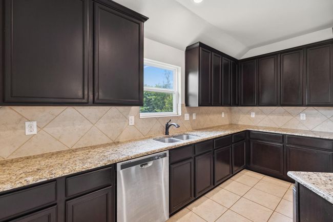 Undermount kitchen sink with window view of backyard | Image 11