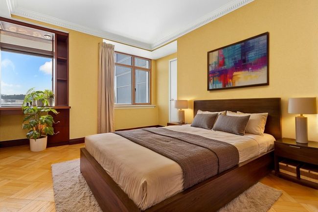 Bedroom featuring crown molding and multiple windows | Image 15