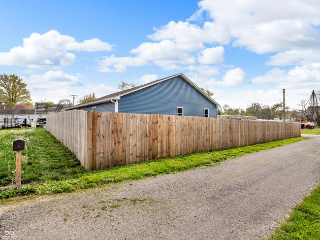 view of property exterior featuring fence | Image 25