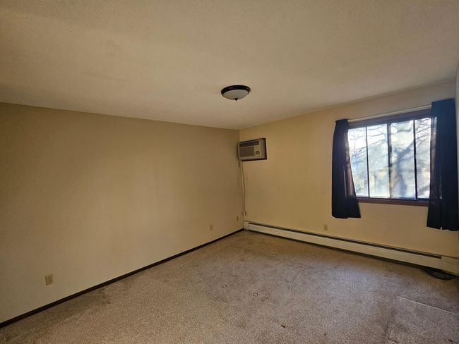 Primary bedroom has A/C | Image 14