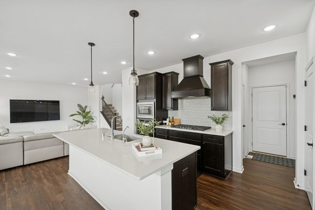 The tile backsplash is a perfect finish for this kitchen. | Image 12