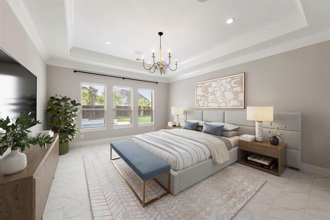 Tranquil and sunlit, this sophisticated primary suite features a tray ceiling, a soft neutral palette, and panoramic backyard views—creating a peaceful retreat that blends classic elegance with everyday luxury. *This photo has been virtually staged.* | Image 20
