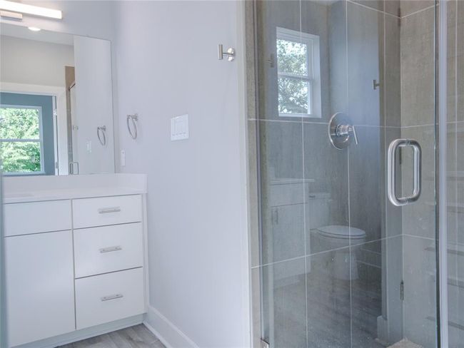 Bathroom with vanity and a stall shower | Image 29