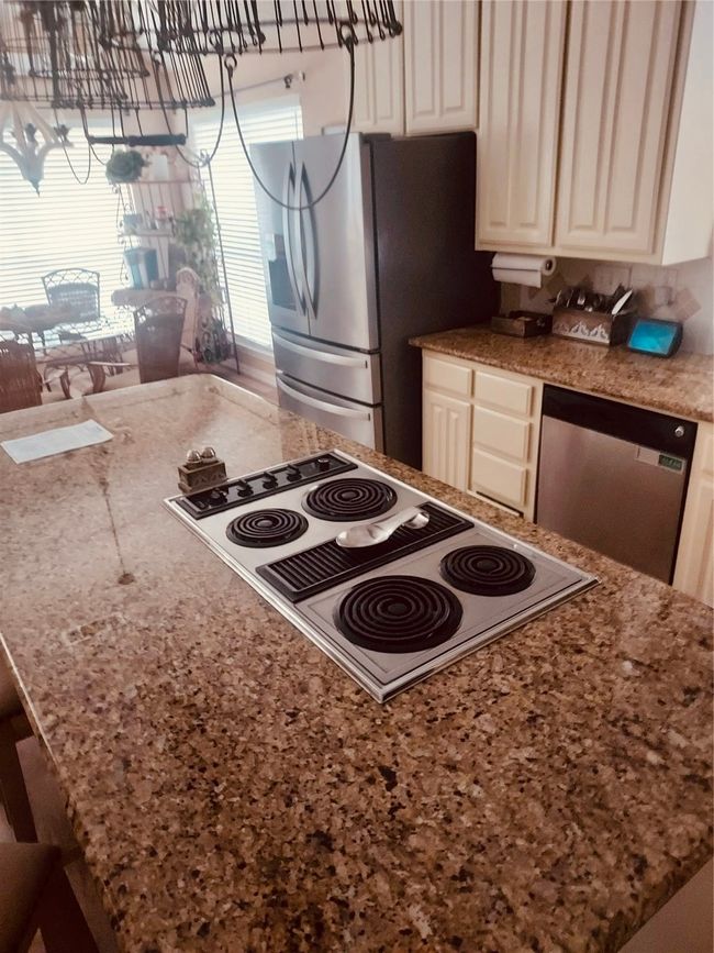 Kitchen with Stainless Steel appliances with oversized center island and ample storage. | Image 9