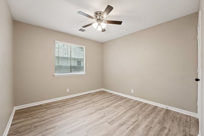 Spare room with light wood-type flooring and ceiling fan | Image 13