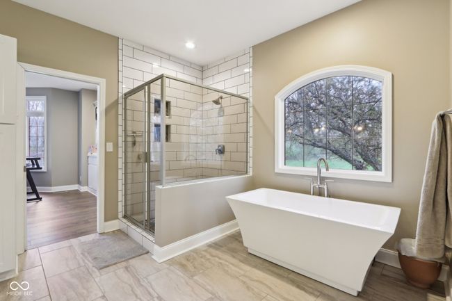 full bathroom featuring baseboards, recessed lighting, a shower stall, and a freestanding bath | Image 30
