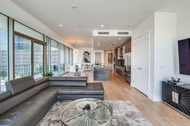 Living room with light wood finished floors and recessed lighting | Image 13