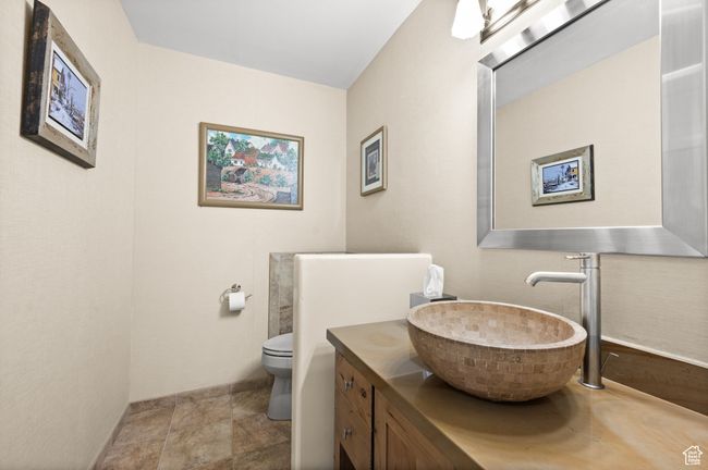 Bathroom featuring vanity and toilet | Image 13