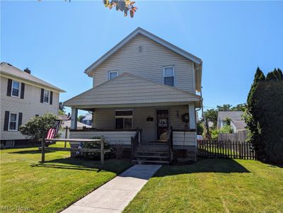 View of front of home with a front yard and covered porch | Image 2