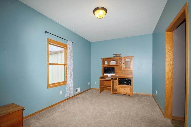 Main floor- Den, office, convert to a bedroom, library, toy room- the possibilities are endless! | Image 10