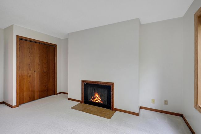 2nd Bedroom w/Gas Fireplace | Image 32
