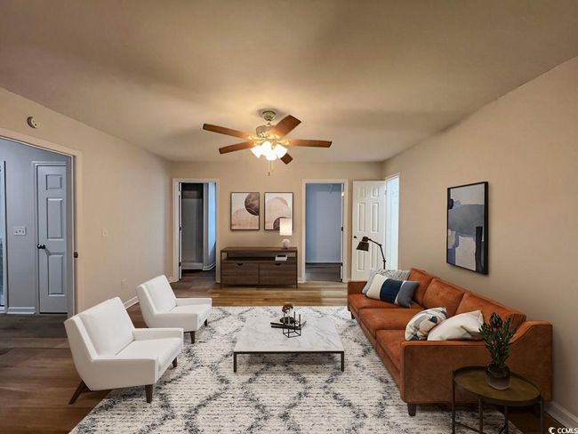 Living room featuring baseboards, wood finished floors, and a ceiling fan | Image 7