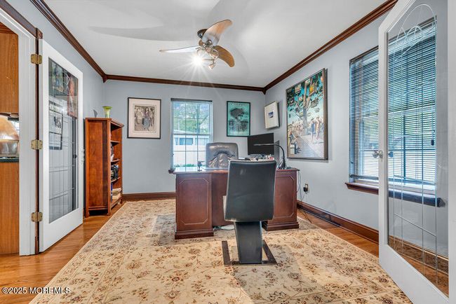 Beautiful French doors open to a office | Image 10