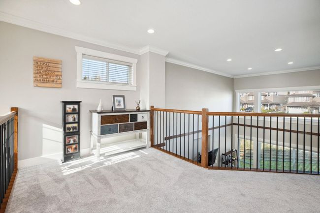 Hall featuring baseboards, ornamental molding, plenty of natural light, and recessed lighting | Image 16