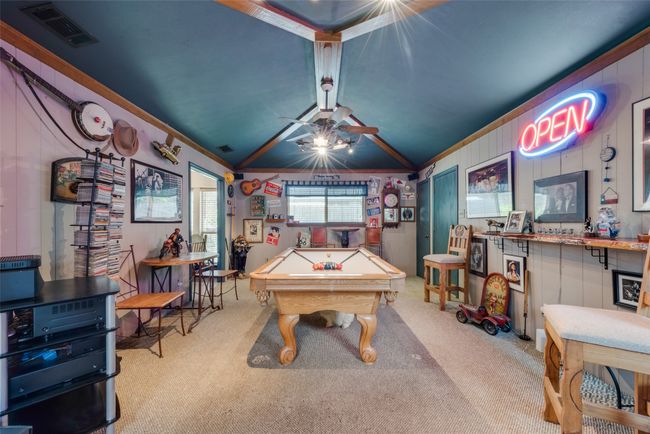 Recreation room featuring billiards table, carpet, crown molding, lofted ceiling, and a ceiling fan | Image 10