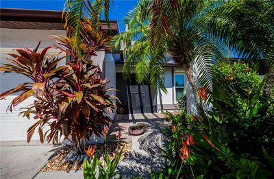 The beautiful foliage surrounding this villa lends great privacy. | Image 1