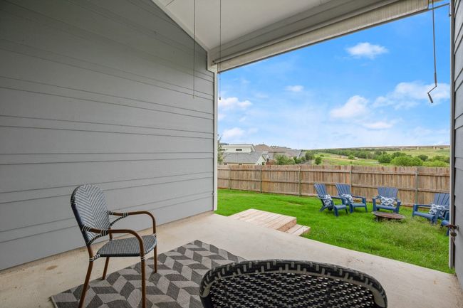 View of patio featuring an outdoor fire pit | Image 22