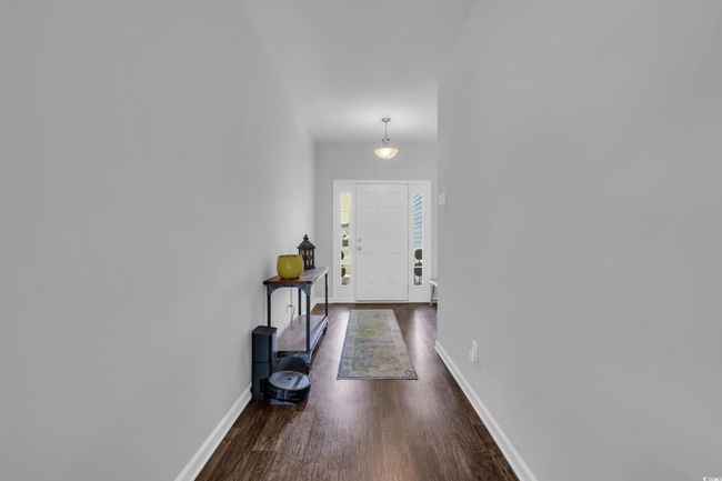 Foyer entrance featuring dark wood-type flooring and baseboards | Image 9
