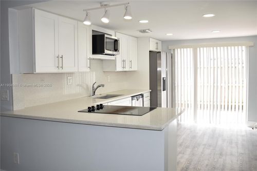 e-4-312 Sw 1st St, Pompano Beach, FL, 33060-4656 | Card Image