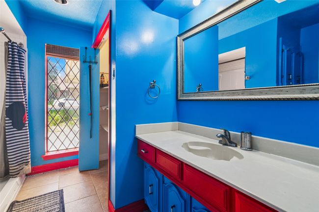 Full bathroom with vanity, tile patterned floors, and curtained shower | Image 21