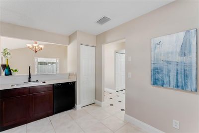 Pass through space/ breakfast bar to dining room | Image 3