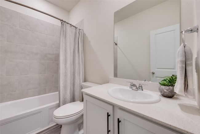 Full bathroom featuring vanity and shower / bath combo | Image 13
