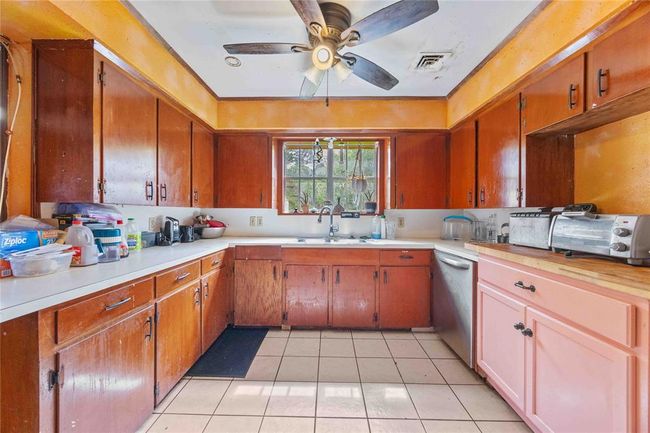 The pink rolling cabinet is where the fridge goes. | Image 5