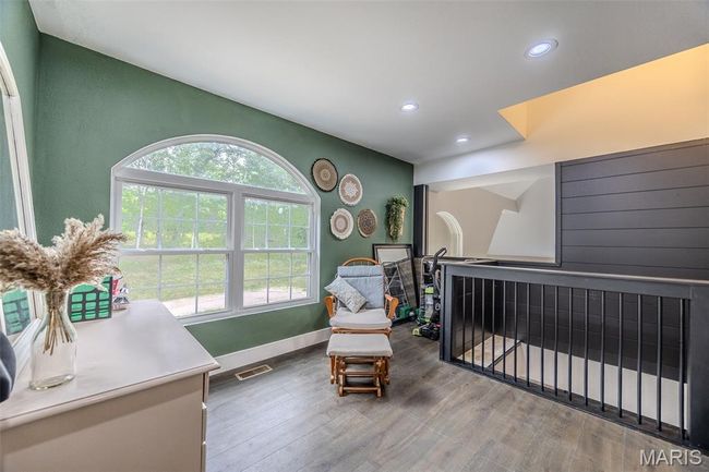 Sitting room featuring wood finished floors and recessed lighting | Image 42