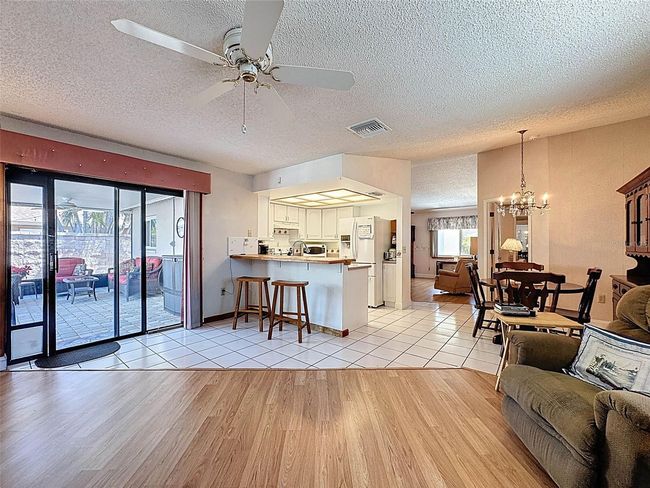 family room leading to screened in lanai | Image 18