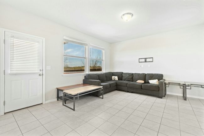 Living room featuring baseboards and light tile patterned flooring | Image 10