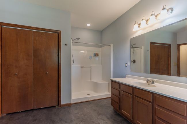Main bath features large linen closet as well as a 2nd closet with washer dryer hookups. | Image 16