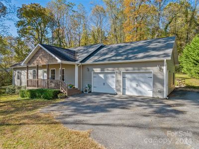 With a roomy 2 car garage and plenty of additional parking, this home is a wonderful place to gather. | Image 2