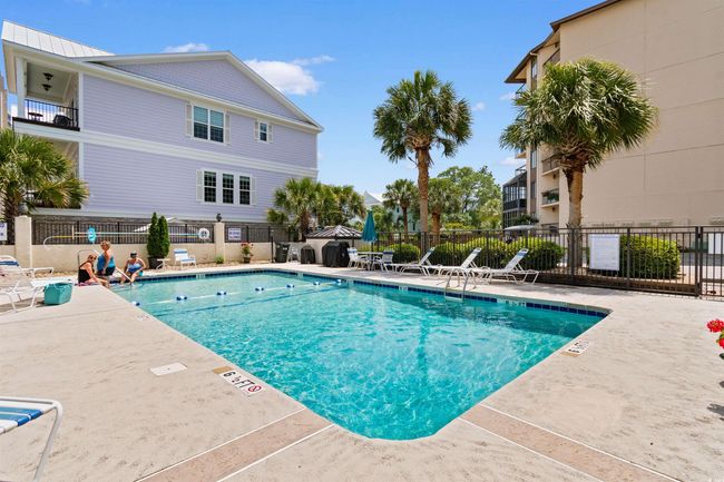 Community pool featuring fence and a patio | Image 27