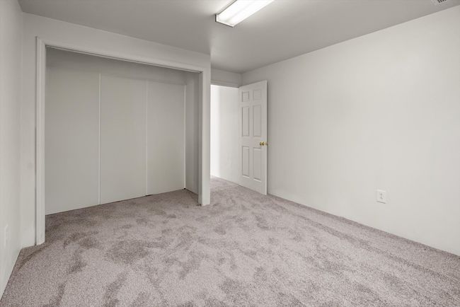 Unfurnished bedroom with carpet and a closet | Image 33