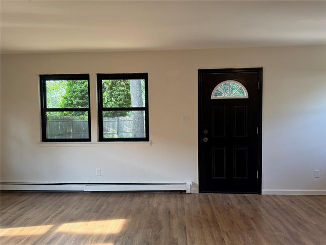 View of front facade featuring an attached garage and concrete driveway | Image 9