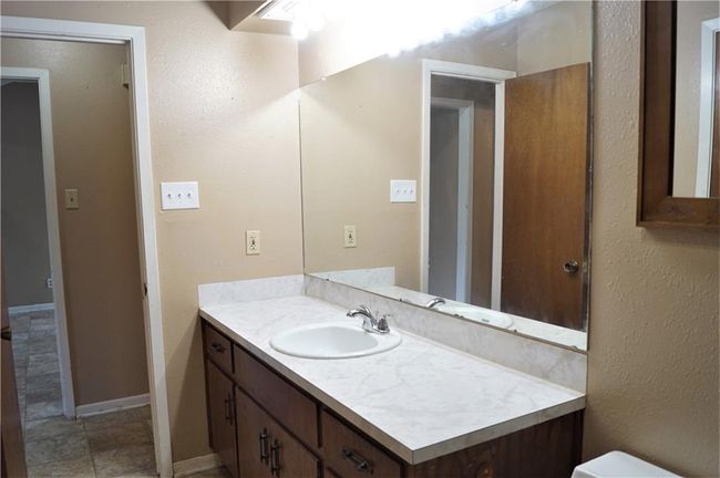 Bathroom featuring vanity and toilet | Image 10
