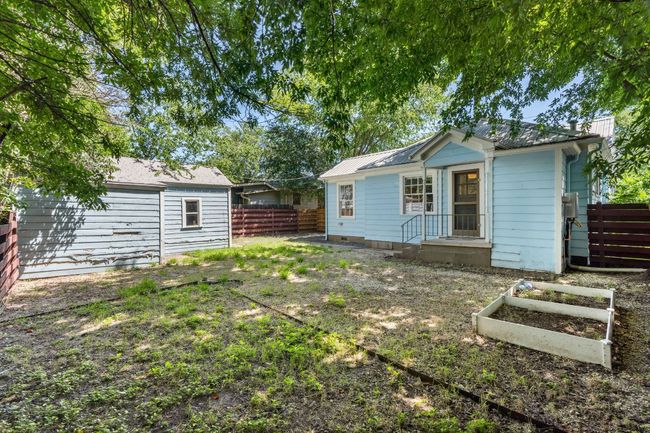 The fully fenced backyard is a great canvas for personalizing your private outdoor space. There are endless possibilities for entertaining, gardening, and playing with your pups. | Image 15