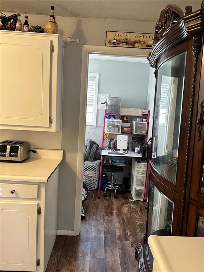 Laundry area with dark wood-style floors | Image 26