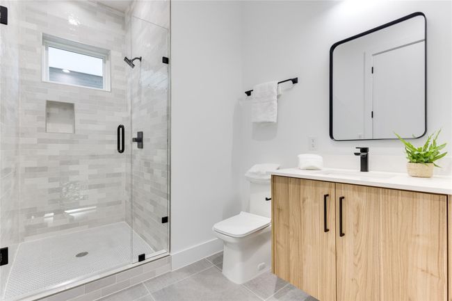 Bathroom featuring vanity, an enclosed shower, tile patterned floors, and toilet | Image 29
