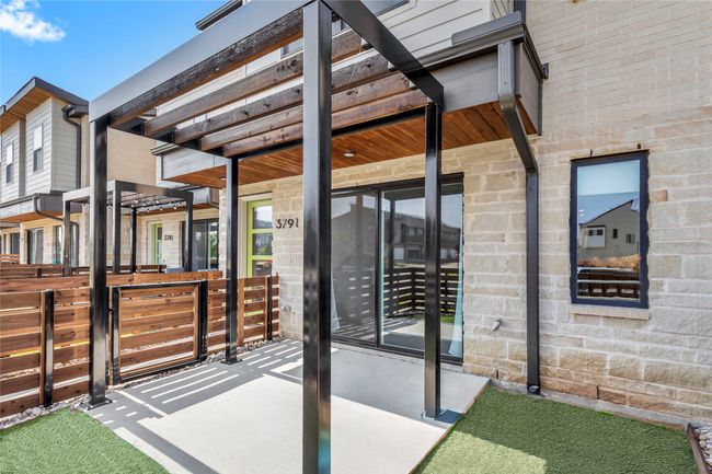 Turfed patio area for easy outdoor living. | Image 29