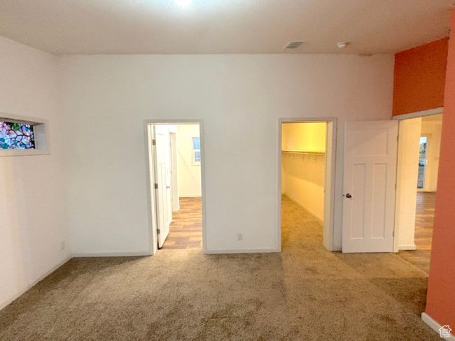 Looking from master bedroom into closet on right and bathroom on left | Image 13