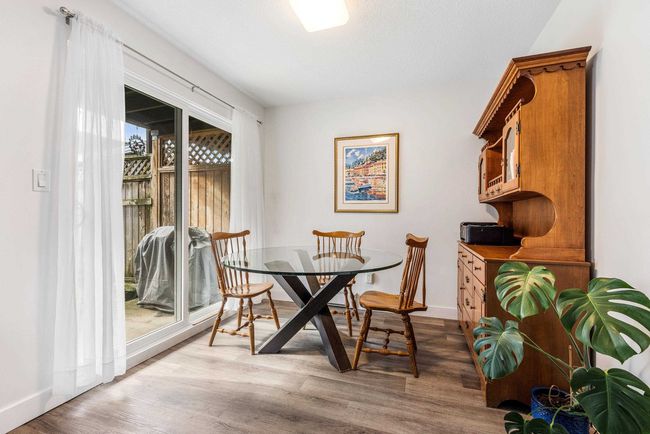 Dining space with baseboards and light wood finished floors | Image 4