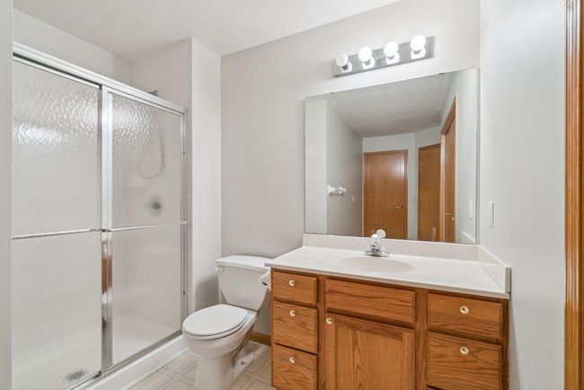 Additional main level bathroom with nice oak cabinets | Image 18