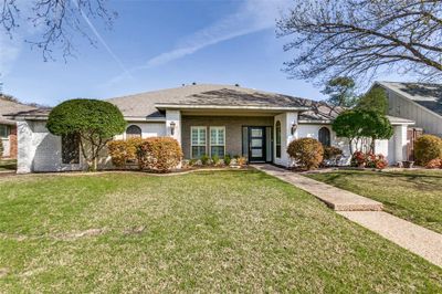 Ranch-style house featuring a front lawn | Image 1