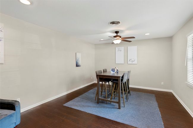 Dining room featuring hardwood / wood-style flooring, baseboards, a ceiling fan, and recessed lighting | Image 4