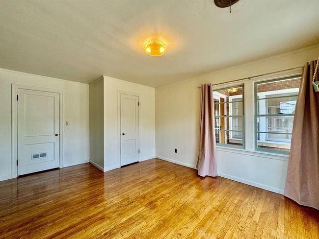 Spare room featuring light wood-type flooring and baseboards | Image 20