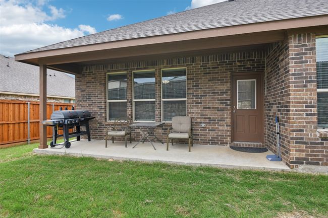 View of patio featuring grilling area | Image 36