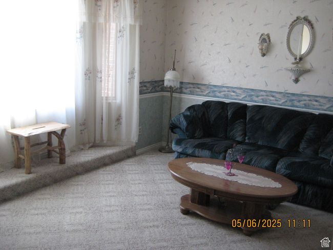 Carpeted living room featuring wallpapered walls | Image 12
