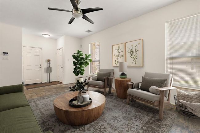Charming and cozy living room perfect for relaxation in this beautifully designed condo. | Image 5