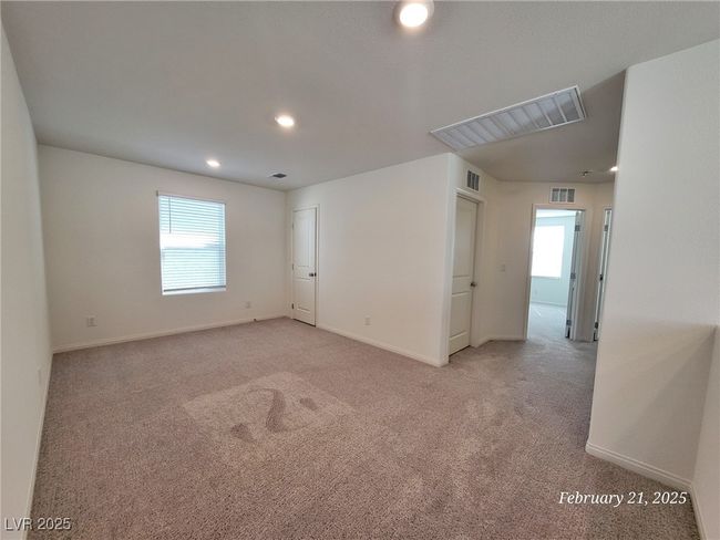 Empty room with light carpet, a healthy amount of sunlight, and visible vents | Image 18